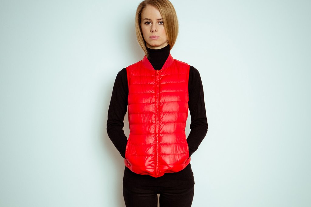 Giulia wearing the signal red goose down liner vest