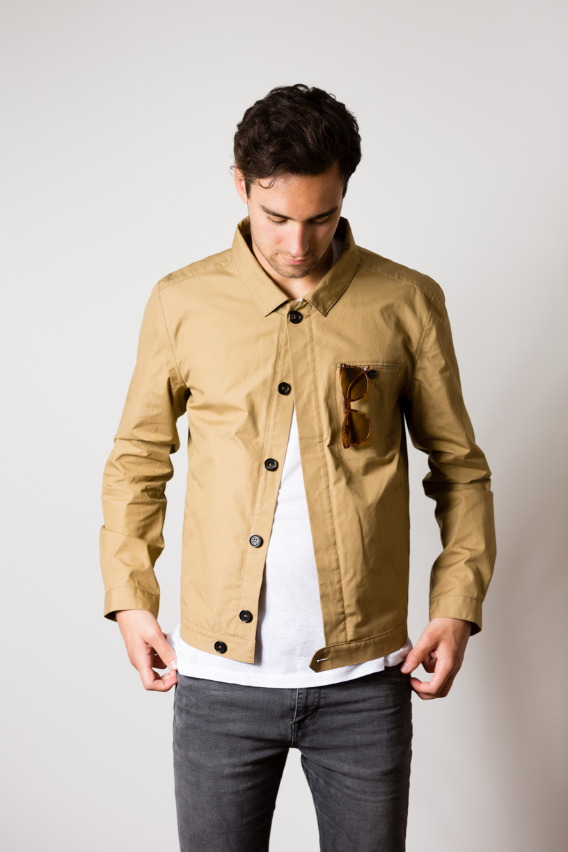 Manu wearing the w'lfg'ng British Millerain Worker Jacket in colour sand